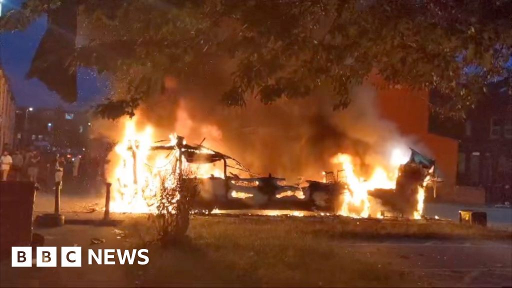 Bus on fire and police car overturned in disorder